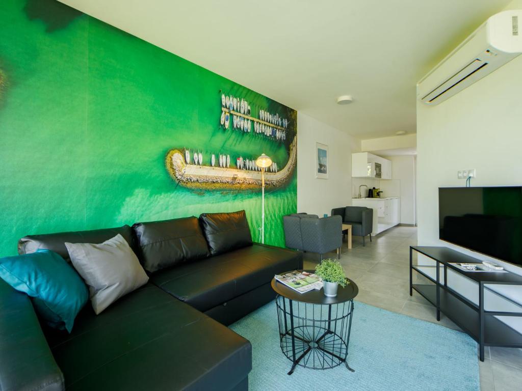Televízia a/alebo spoločenská miestnosť v ubytovaní Apartment Földvár by Interhome