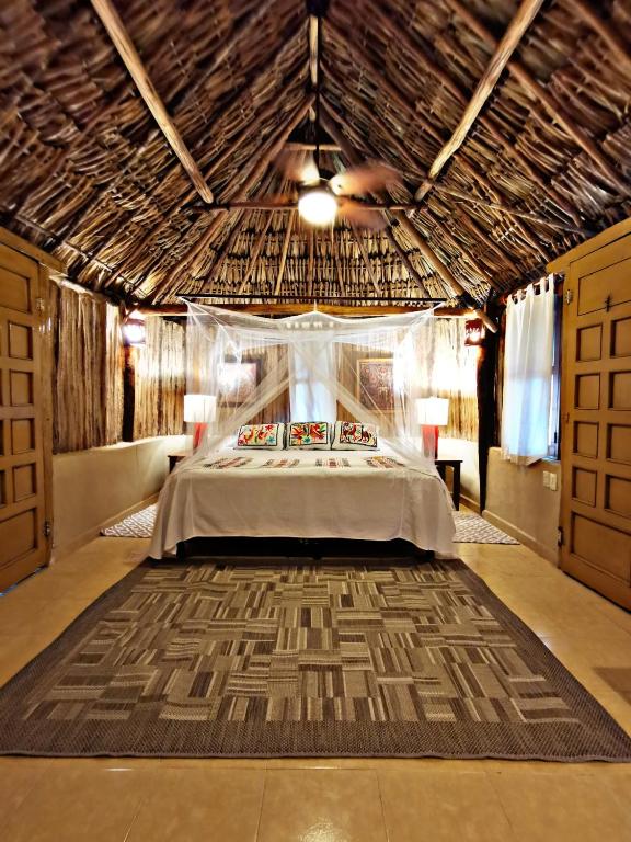 Postel nebo postele na pokoji v ubytování Casa Quetzal Hotel