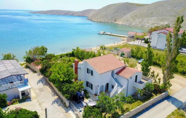 an aerial view of a house next to the water at Beach House Mela in Pag