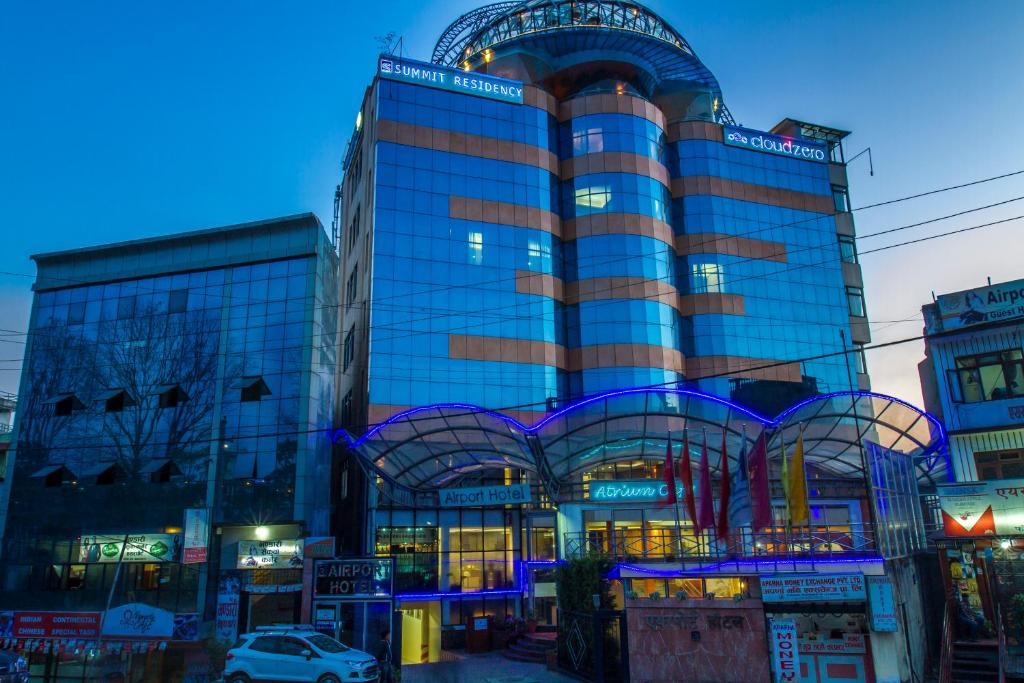 a large building with blue lights on it at Airport Hotel in Kathmandu
