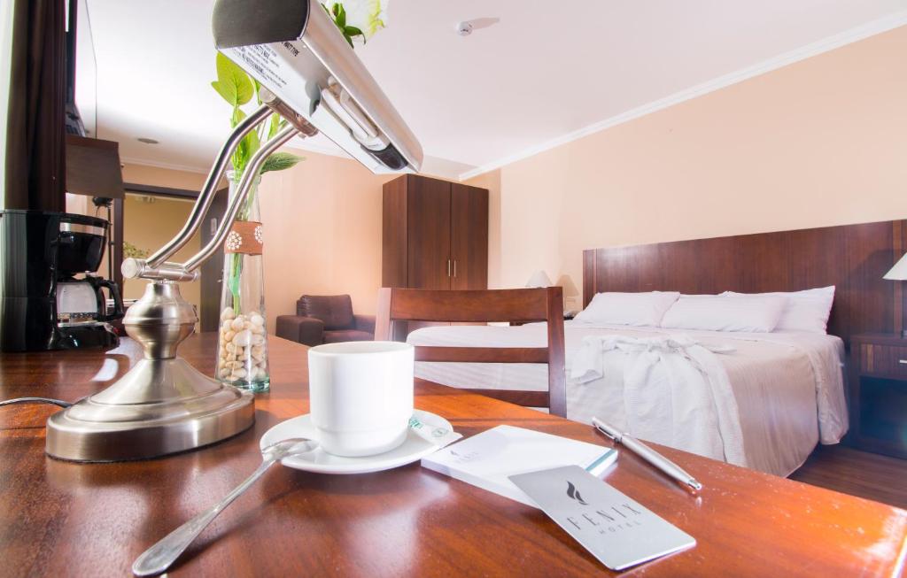 Postel nebo postele na pokoji v ubytování Fenix Hotel