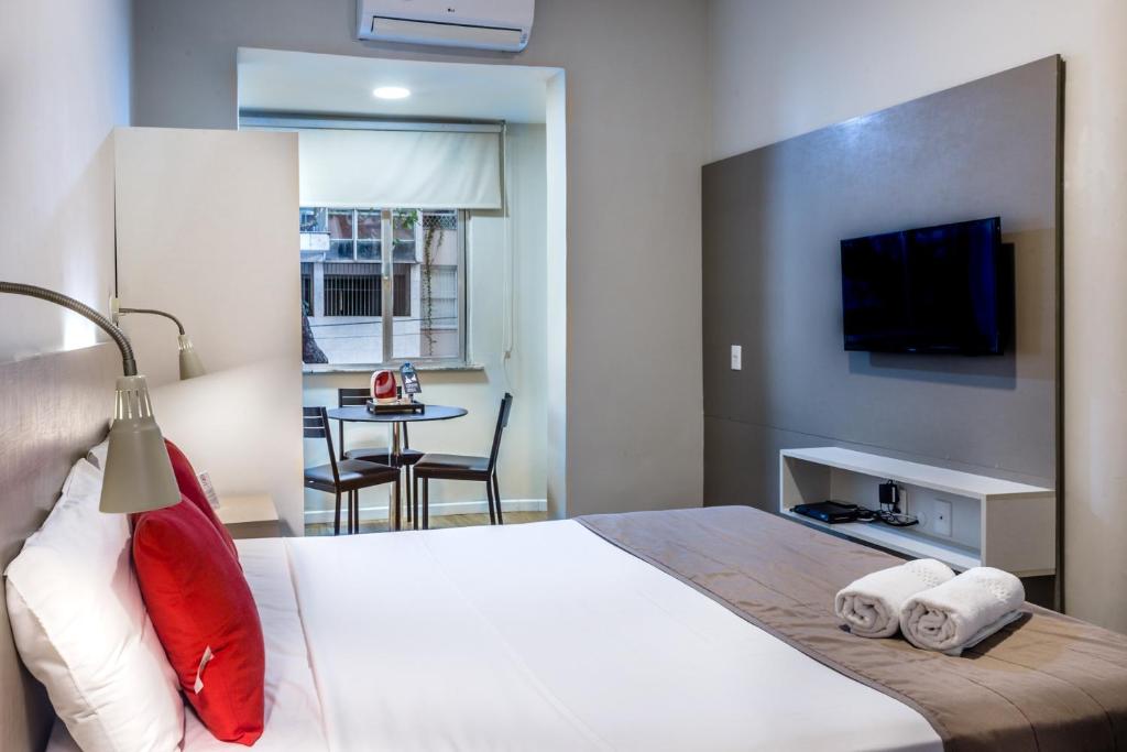 Cama ou camas em um quarto em Injoy Lofts & Studios Ipanema