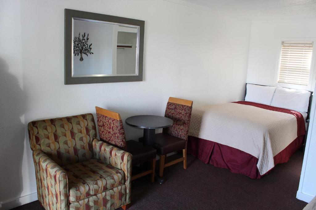 Postel nebo postele na pokoji v ubytování Chalet Motel