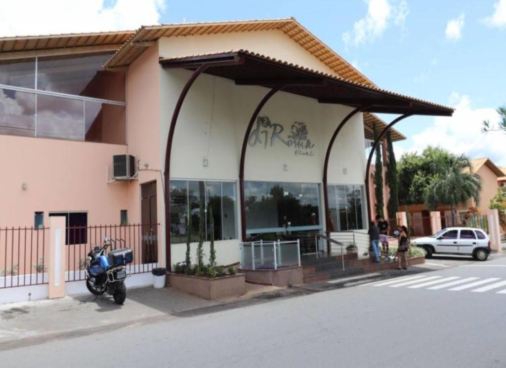 a motorcycle parked in front of a building at Fiori Caldas Novas - 245 in Caldas Novas