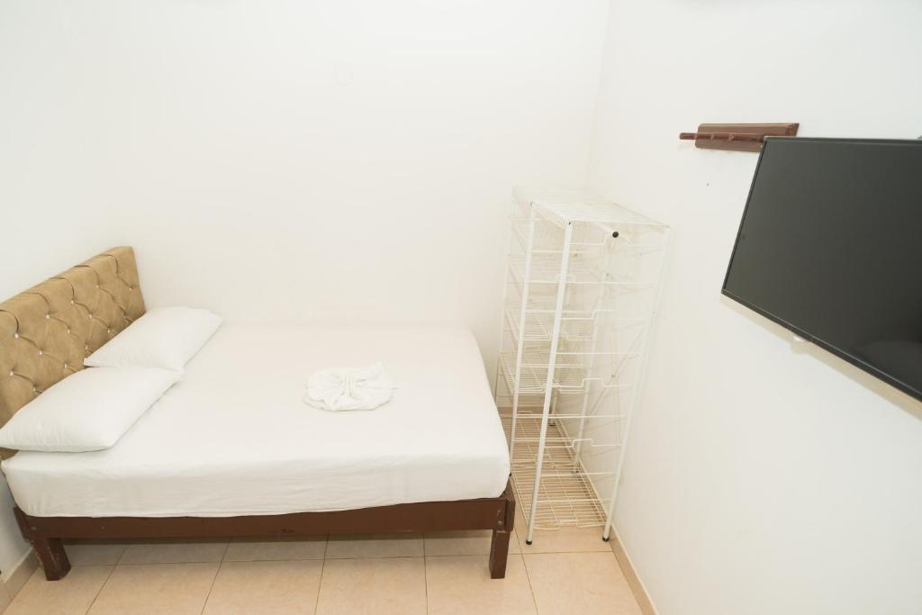 Postel nebo postele na pokoji v ubytování Hotel Clau