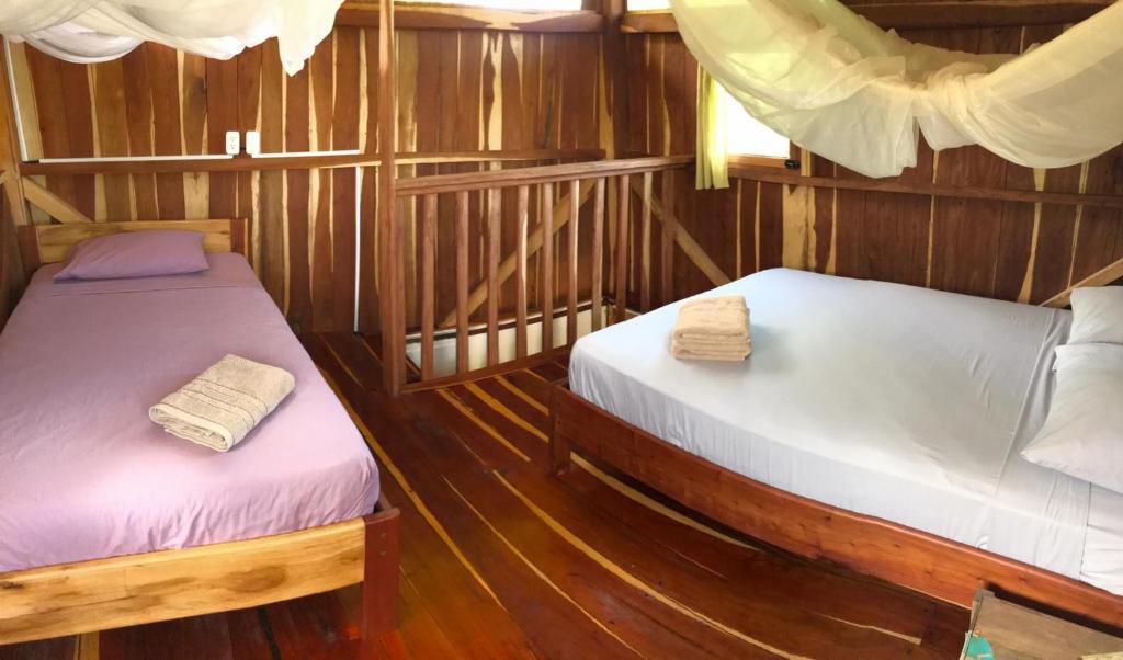 Postel nebo postele na pokoji v ubytování Quinta El Mamey