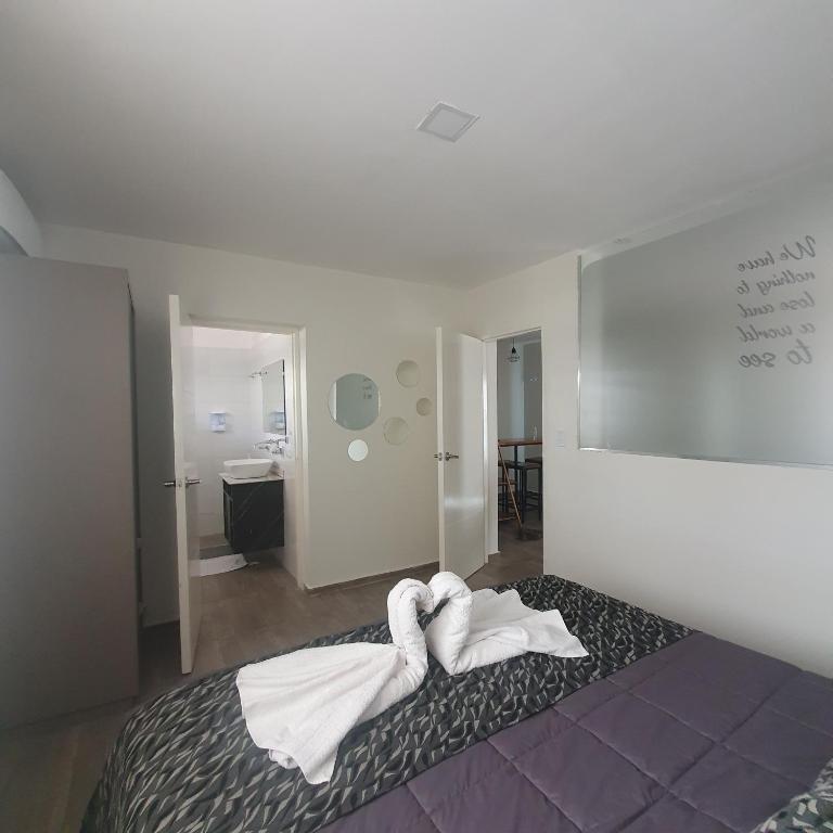 Una cama o camas en una habitación de BLU APARTMENTS