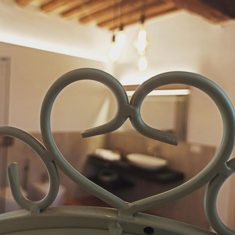 Postel nebo postele na pokoji v ubytování La Corte Dei Sogni B&B