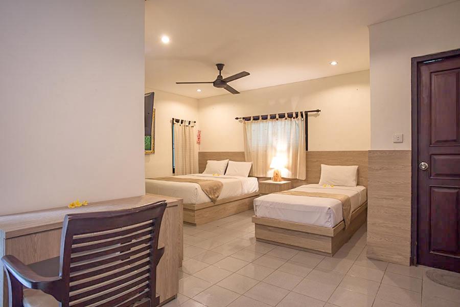 Postel nebo postele na pokoji v ubytování Grand Sehati & Spa, Ubud