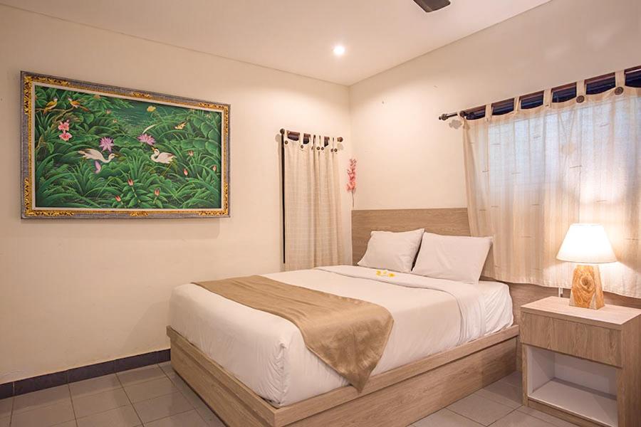 Postel nebo postele na pokoji v ubytování Grand Sehati & Spa, Ubud