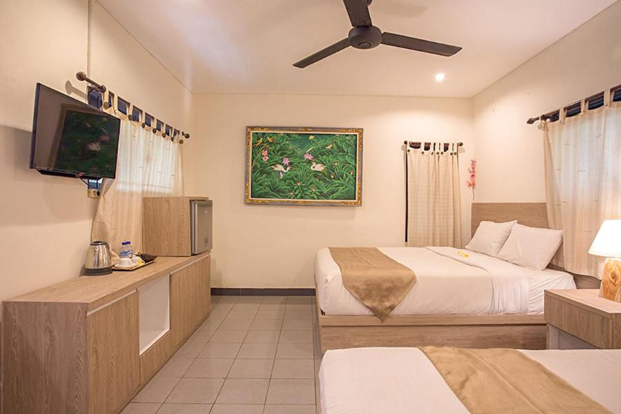 Postel nebo postele na pokoji v ubytování Grand Sehati & Spa, Ubud