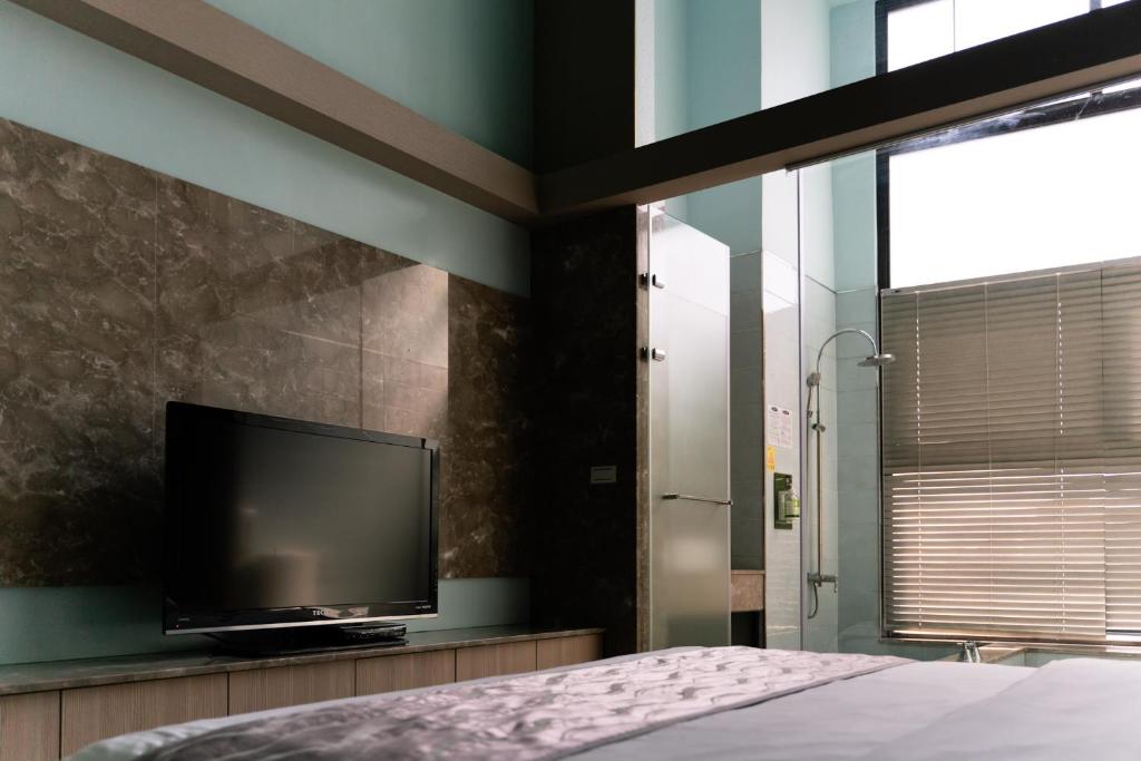 TV a/nebo společenská místnost v ubytování 58˚ Hotspring Hotel