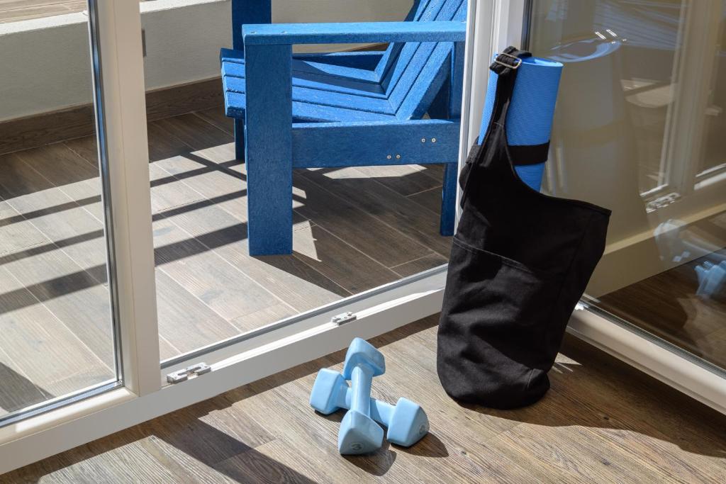 a black bag sitting on the floor next to a mirror at Star inn Peniche in Peniche