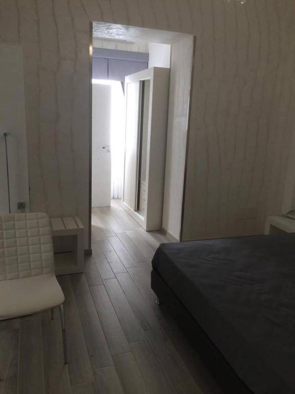 Postel nebo postele na pokoji v ubytování Hotel Paladini