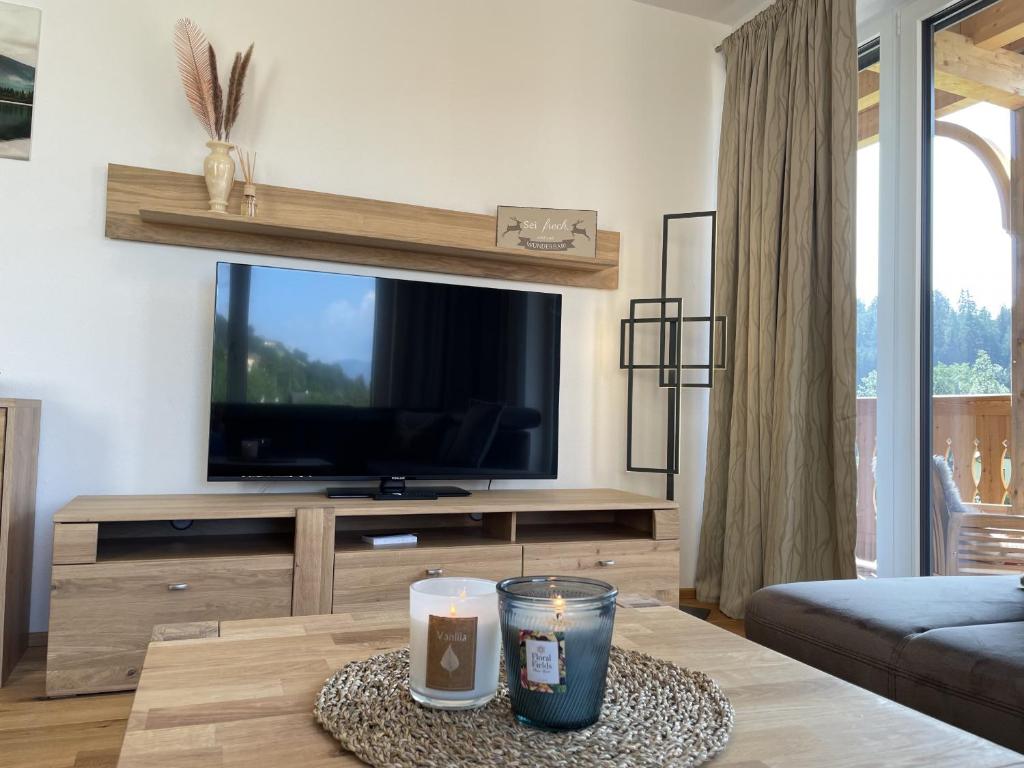 TV a/nebo společenská místnost v ubytování Panorama Lodge Mountainview 208