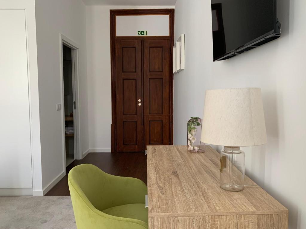 TV a/nebo společenská místnost v ubytování Pharmacia GuestHouse