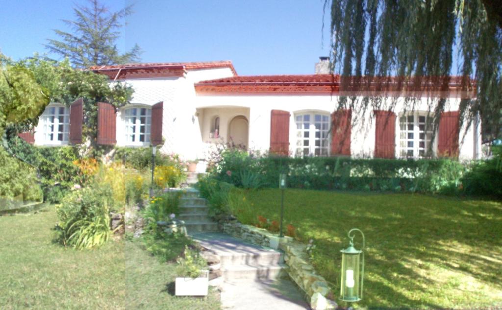 a house with a garden in front of it at Au Soleil d'Albi in Albi