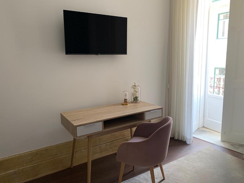 TV a/nebo společenská místnost v ubytování Pharmacia GuestHouse