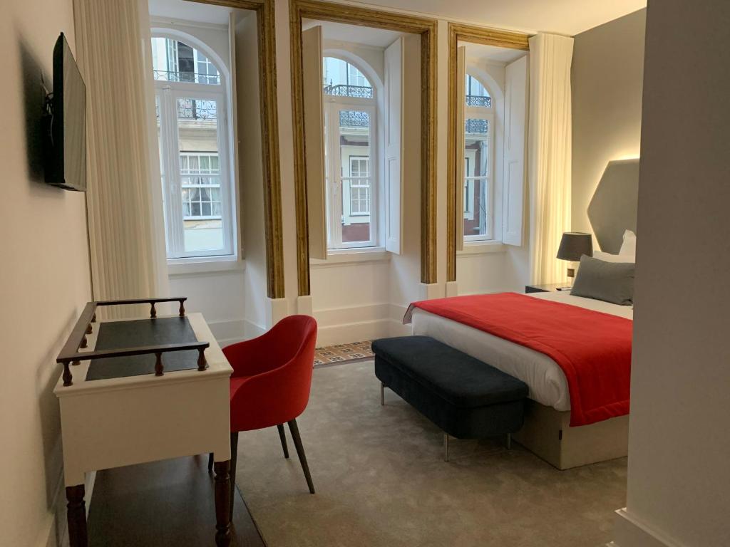 Postel nebo postele na pokoji v ubytování Pharmacia GuestHouse