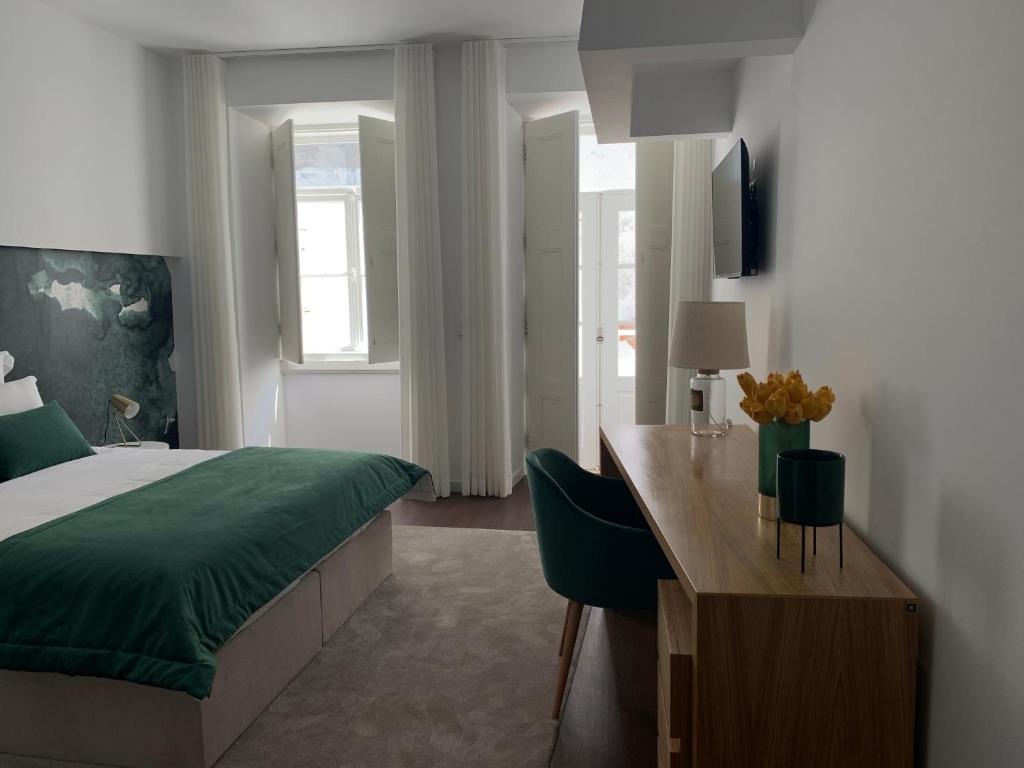 Postel nebo postele na pokoji v ubytování Pharmacia GuestHouse