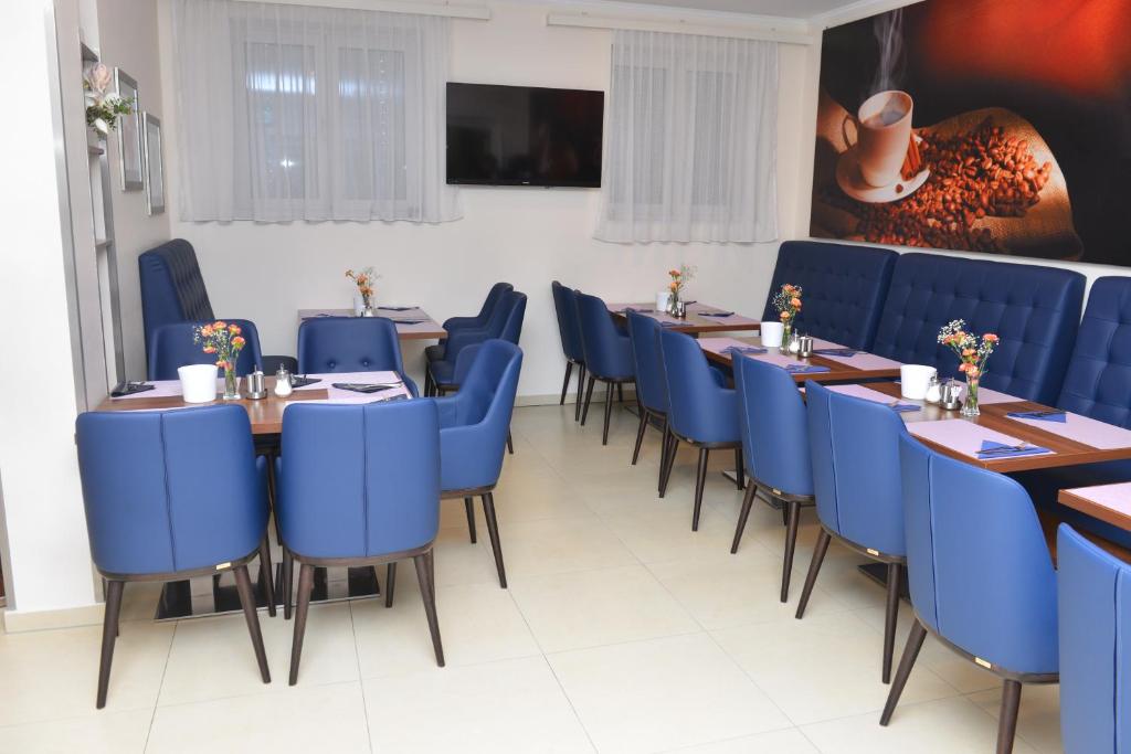 TV a/nebo společenská místnost v ubytování Primus Hotel & Apartments