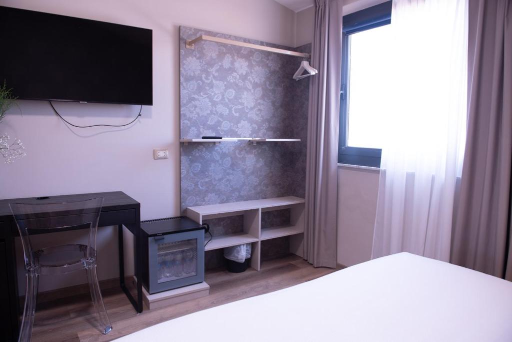 TV a/nebo společenská místnost v ubytování Hotel Della Rosa