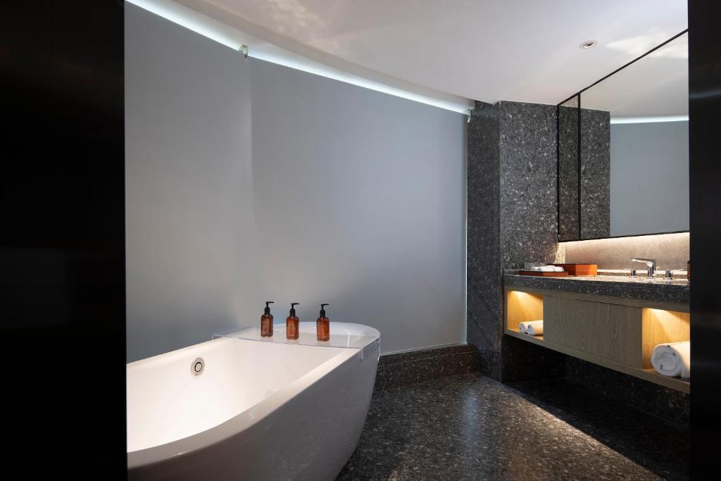 Postel nebo postele na pokoji v ubytování Arthur Hotel Canton Tower Guangzhou-广州塔骑士物语酒店