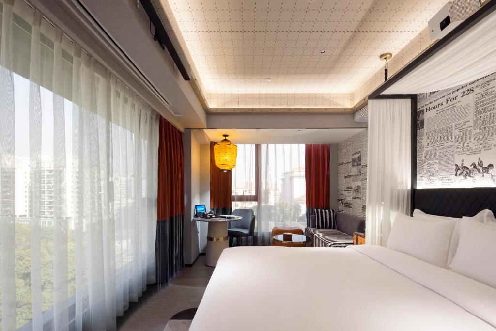 Postel nebo postele na pokoji v ubytování Arthur Hotel Canton Tower Guangzhou-广州塔骑士物语酒店