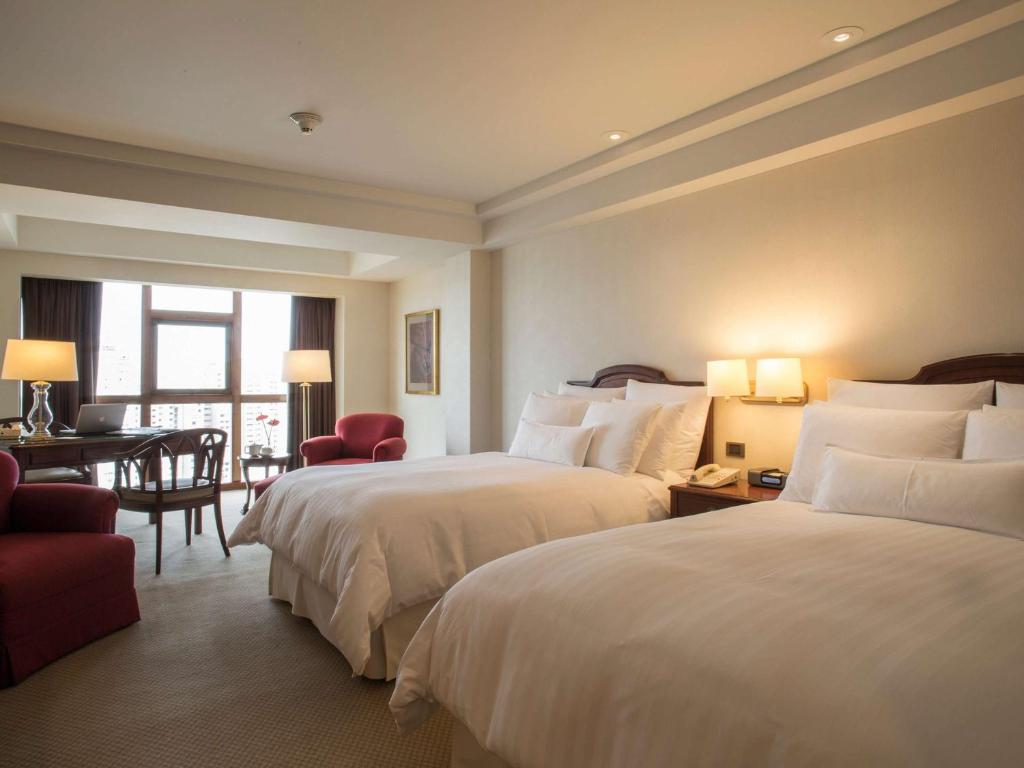 Letto o letti in una camera di Swissotel Lima