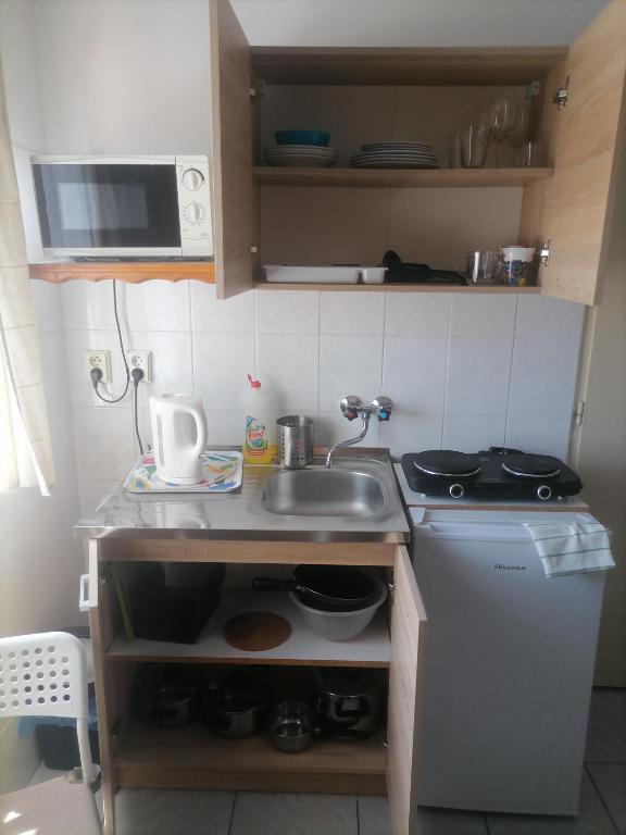 Kuchyň nebo kuchyňský kout v ubytování Ubytovanie Harmony House