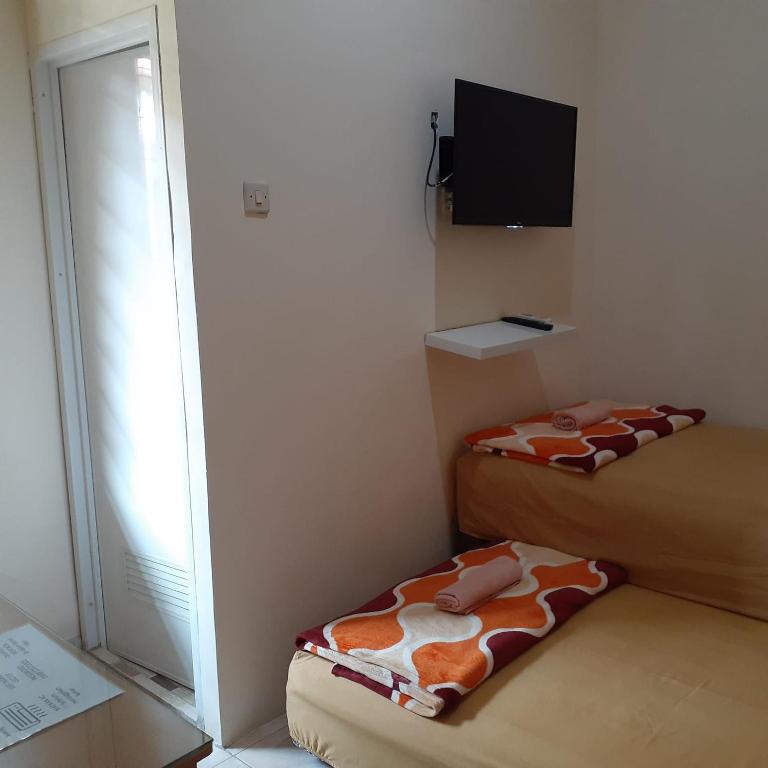 Voodi või voodid majutusasutuse GIO Guesthouse Bogor toas