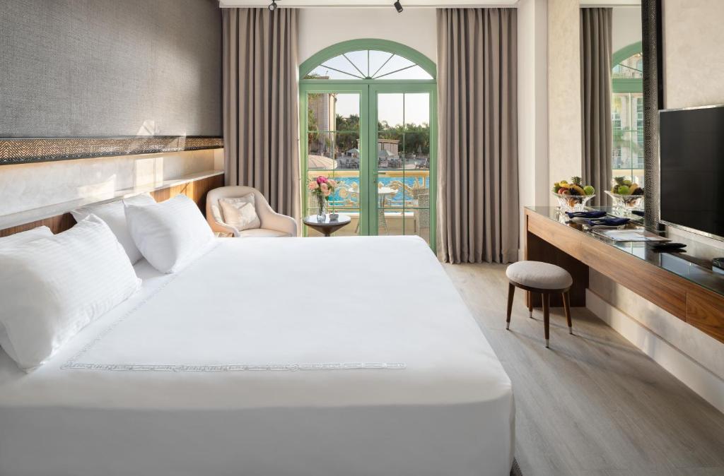 Postel nebo postele na pokoji v ubytování Al Masa Hotel Nasr City