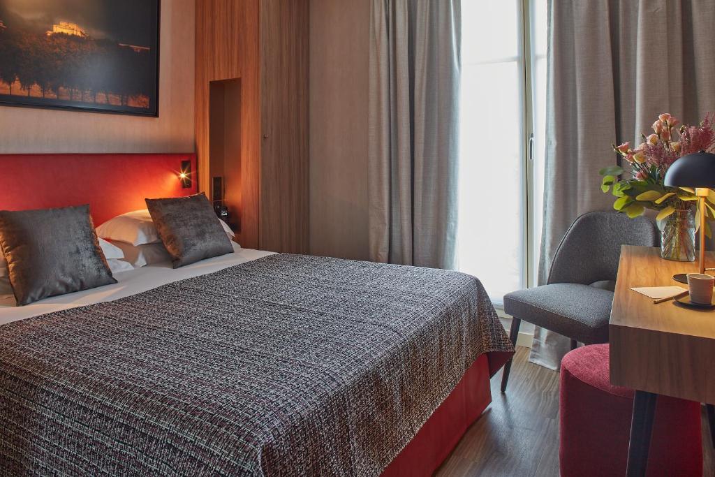 Postel nebo postele na pokoji v ubytování Hotel Atmospheres