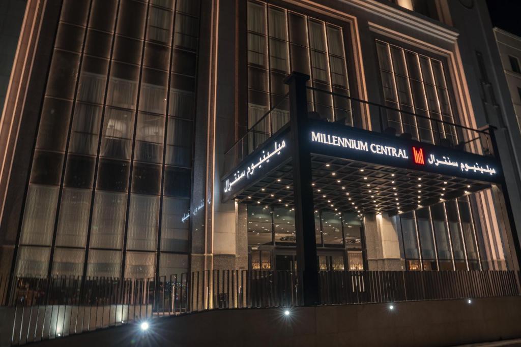 a building with a sign in front of it at Millennium Central Kuwait Downtown in Kuwait