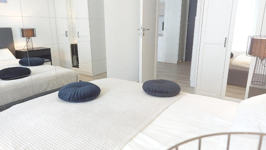 Posteľ alebo postele v izbe v ubytovaní Apartament Mare , Rewal ulica Szczecińska 21 Apartament nr 3