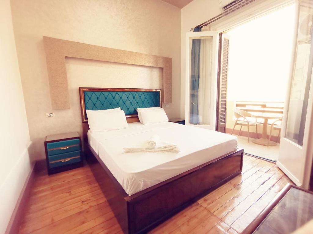 Postel nebo postele na pokoji v ubytování Golden Palace Hotel