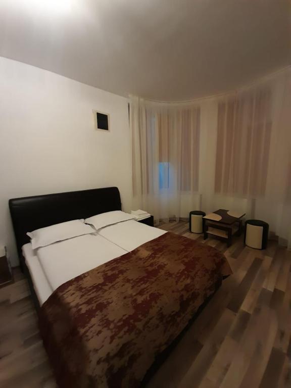 Postel nebo postele na pokoji v ubytování VILA GE