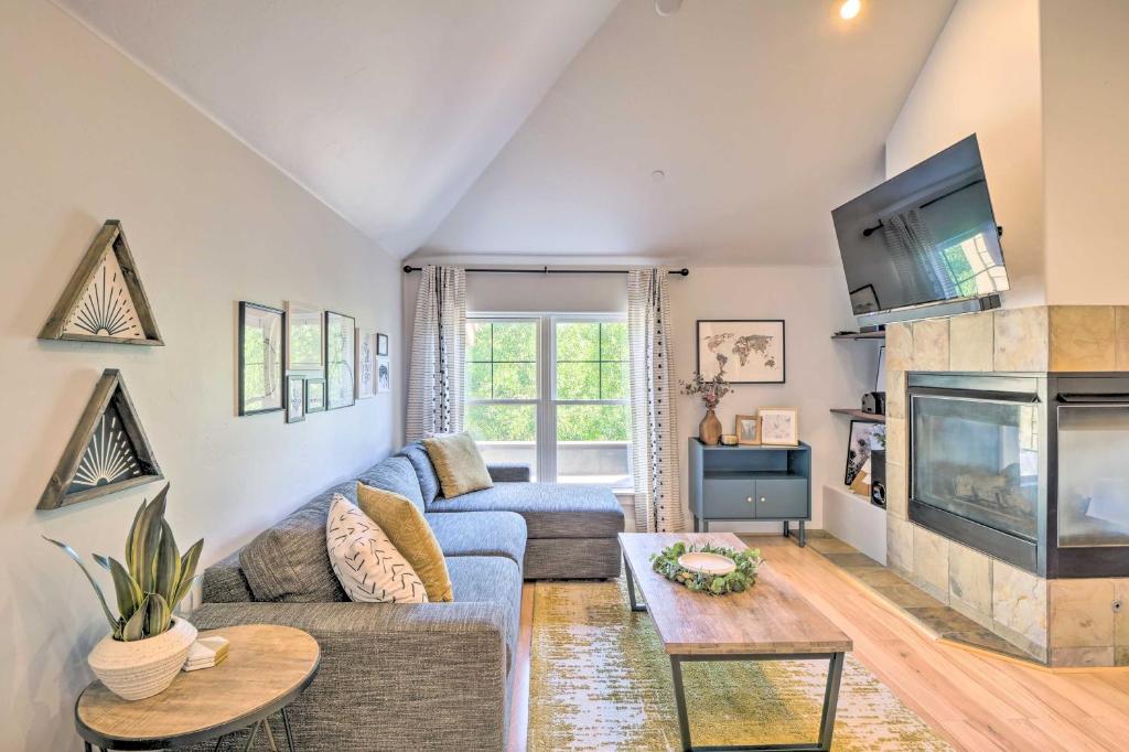 a living room with a couch and a tv at 5 Mi to Ski Resort: Breck Penthouse Studio in Breckenridge