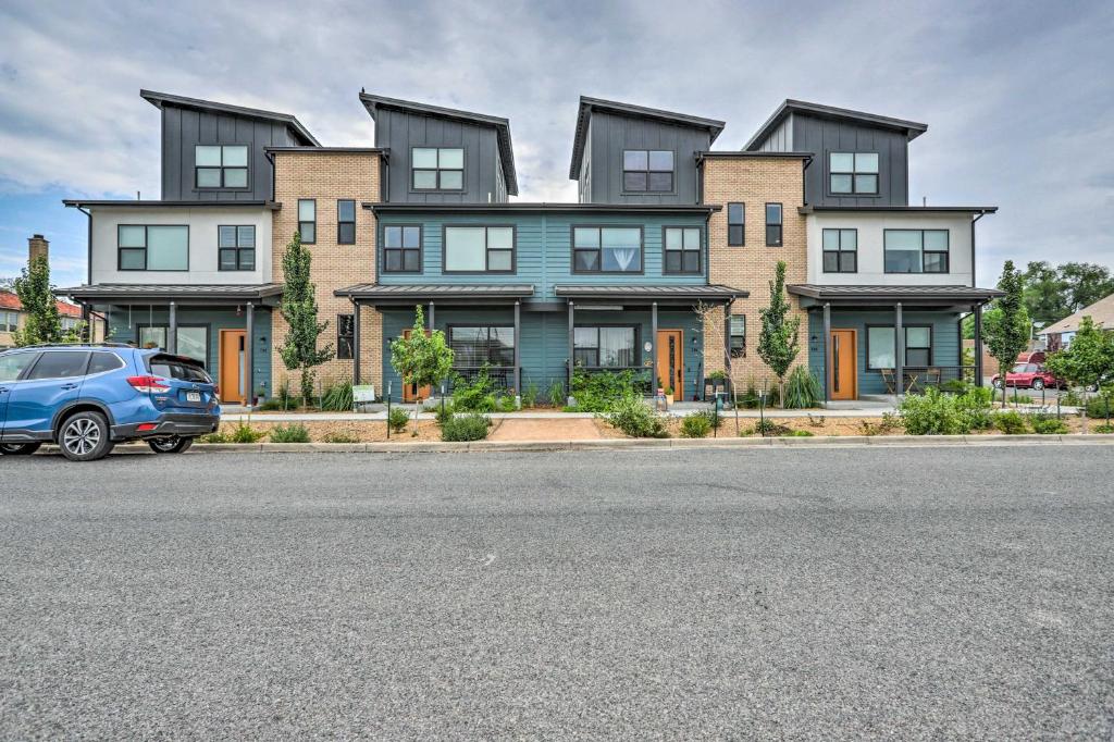 a large house with a car parked in front of it at Luxury Grand Junction Studio Pets Welcome! in Grand Junction