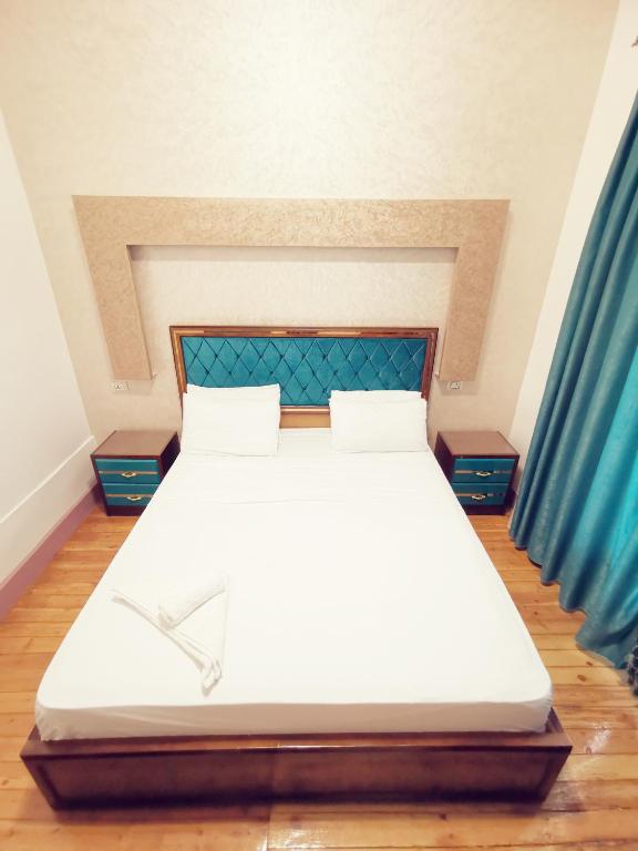 Postel nebo postele na pokoji v ubytování Golden Palace Hotel