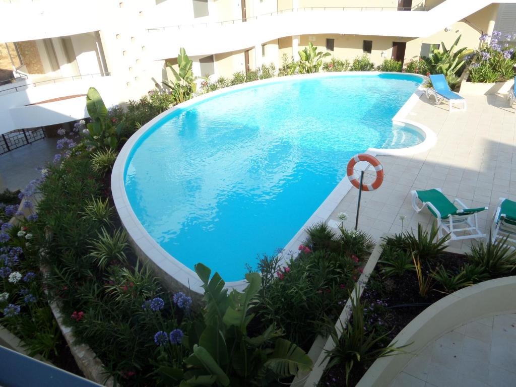 an overhead view of a swimming pool in a building at Albur Village in Alvor