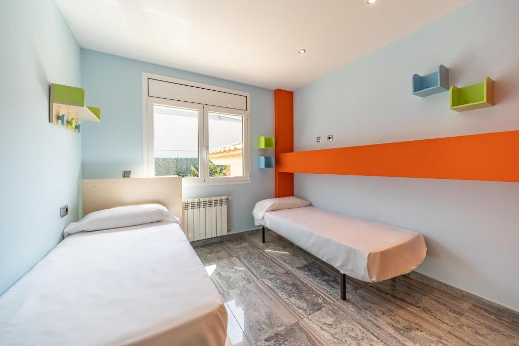 Postel nebo postele na pokoji v ubytování Villa Eugenia