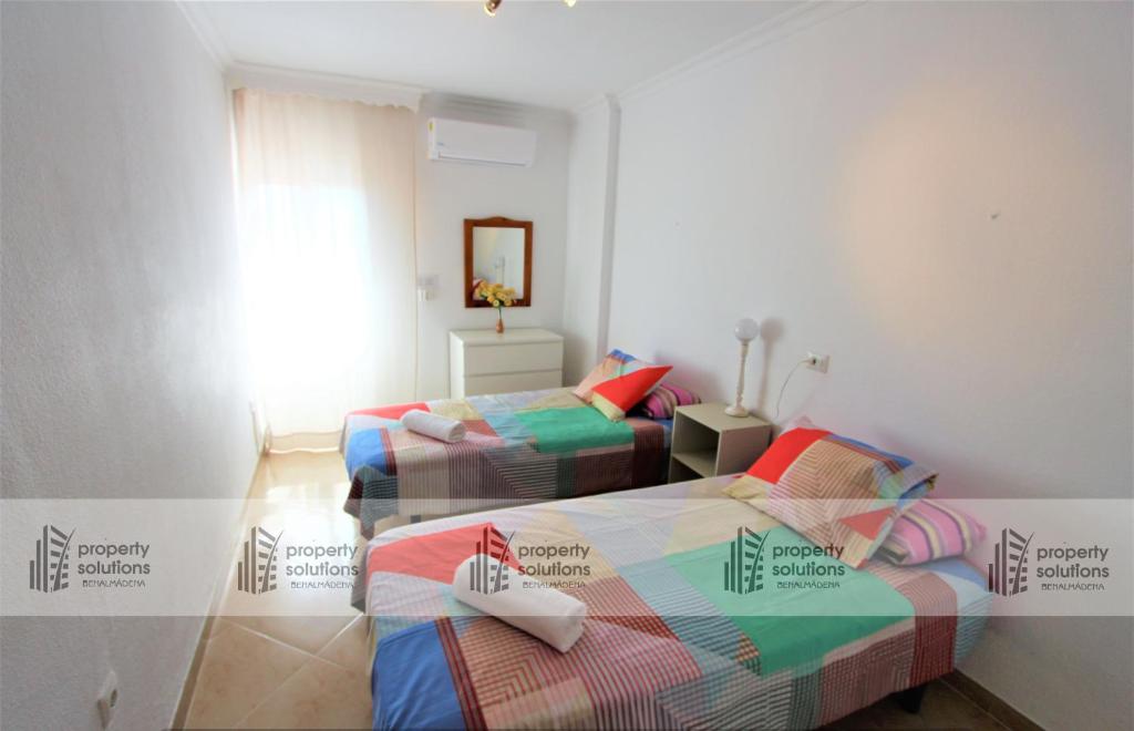 Posteľ alebo postele v izbe v ubytovaní 806 Minerva Apartamento - Vista al mar, la piscina y la montaña - Excelente wifi