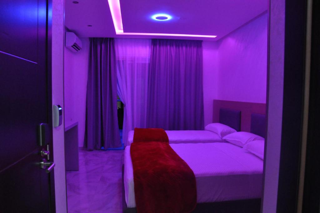 Postel nebo postele na pokoji v ubytování Hôtel laluna bay