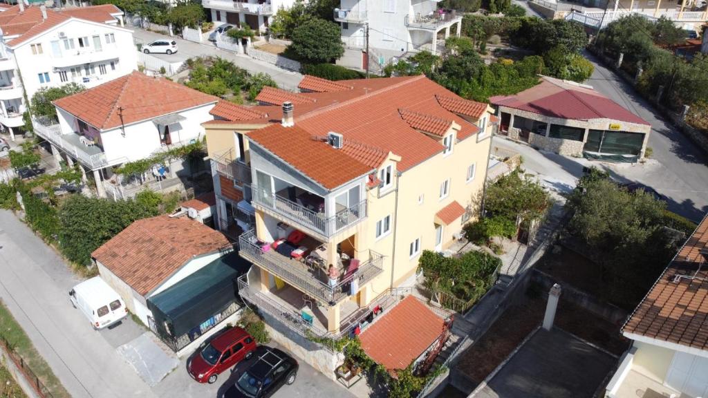an overhead view of a large house with red roofs at Apartments Mara Seget Vranjica in Seget Vranjica