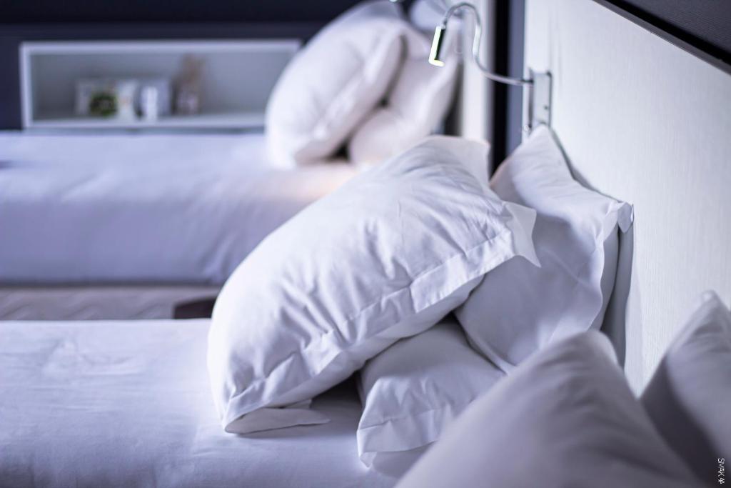 Postel nebo postele na pokoji v ubytování Hotel L'Europe