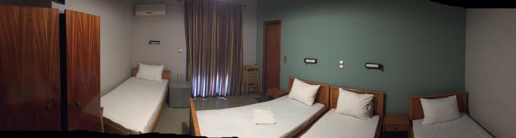 A bed or beds in a room at Artemis