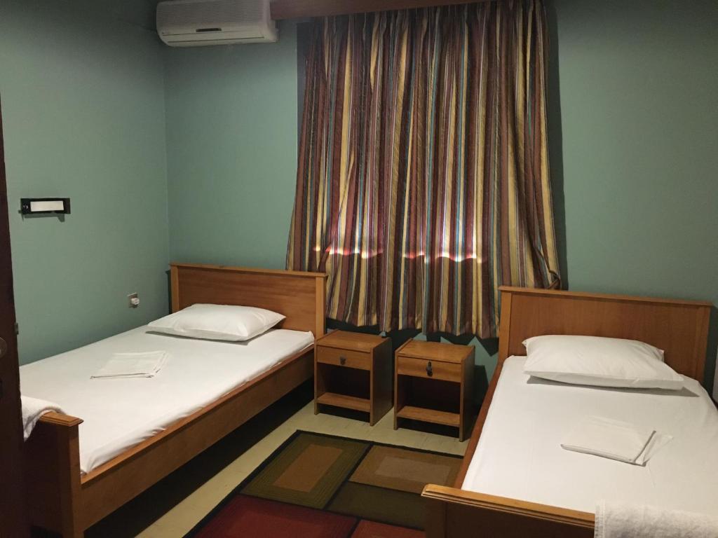 A bed or beds in a room at Artemis