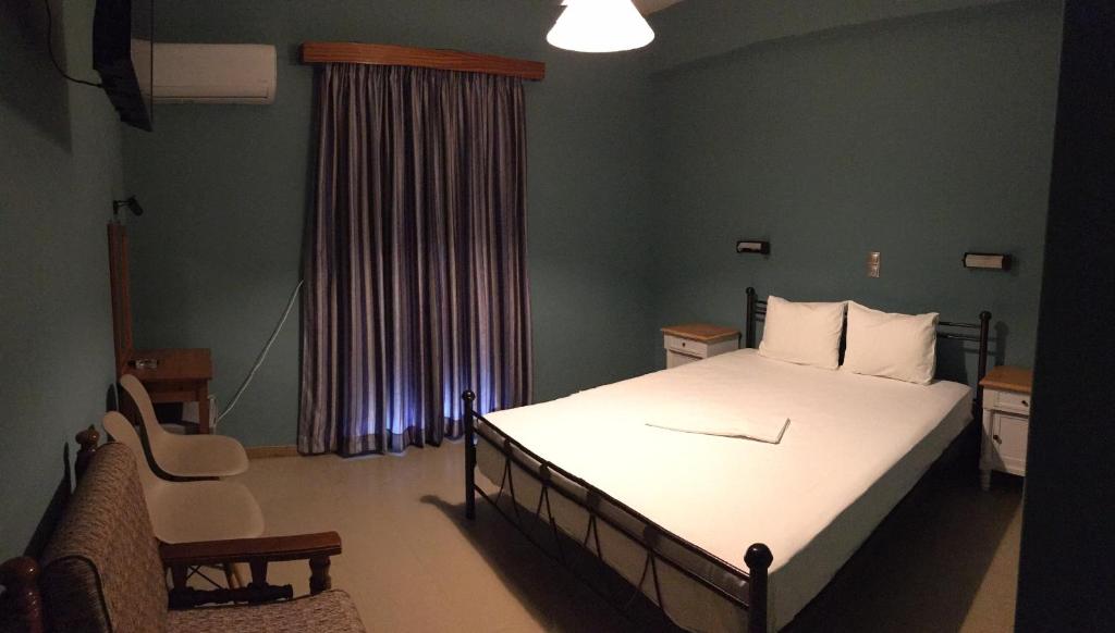 A bed or beds in a room at Artemis