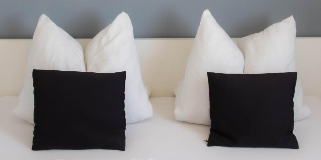 Posteľ alebo postele v izbe v ubytovaní Koller Apartmanház